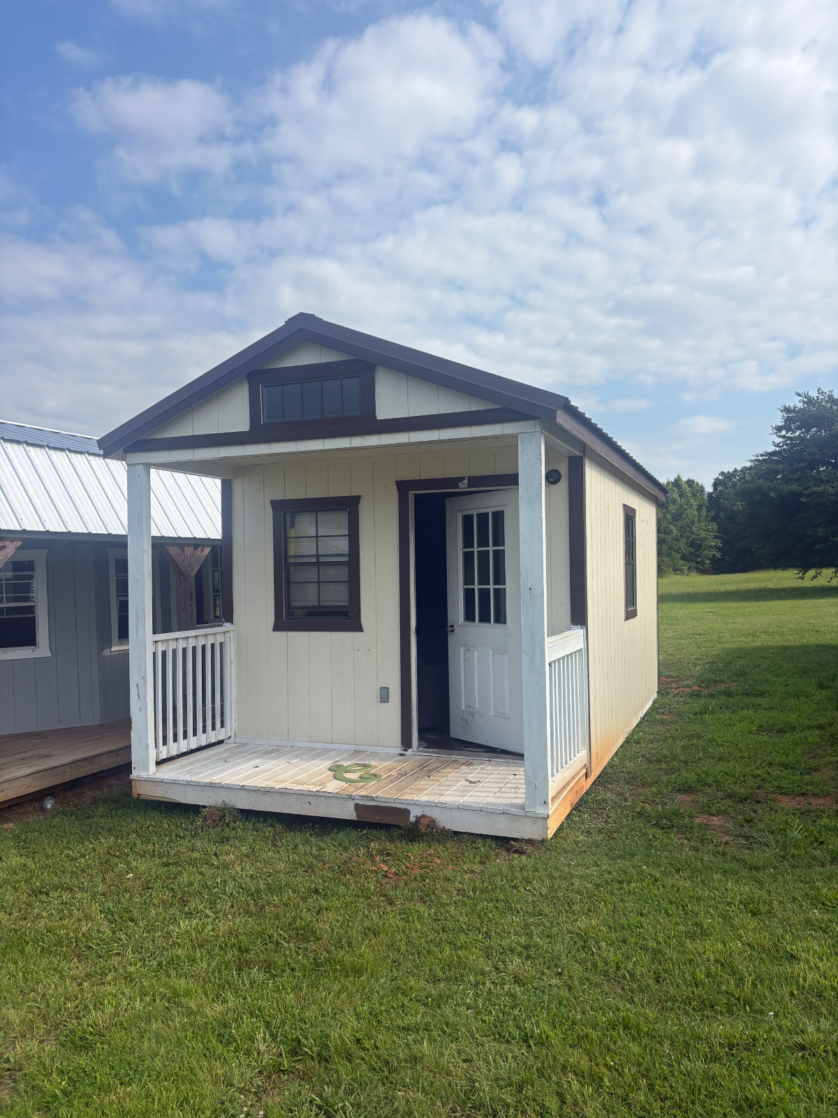 10' x 20' Parton Sheds - Greenville!  Summer Repo Sale!  Save 25% on this Used 10x20 Cabin with Electric for sale in Greenville, SC